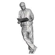 A male figure leaning with newspaper