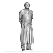 A shopkeeper with hands clasped behind back