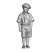 A boy with hands in pockets