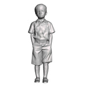 A boy with hands in pockets