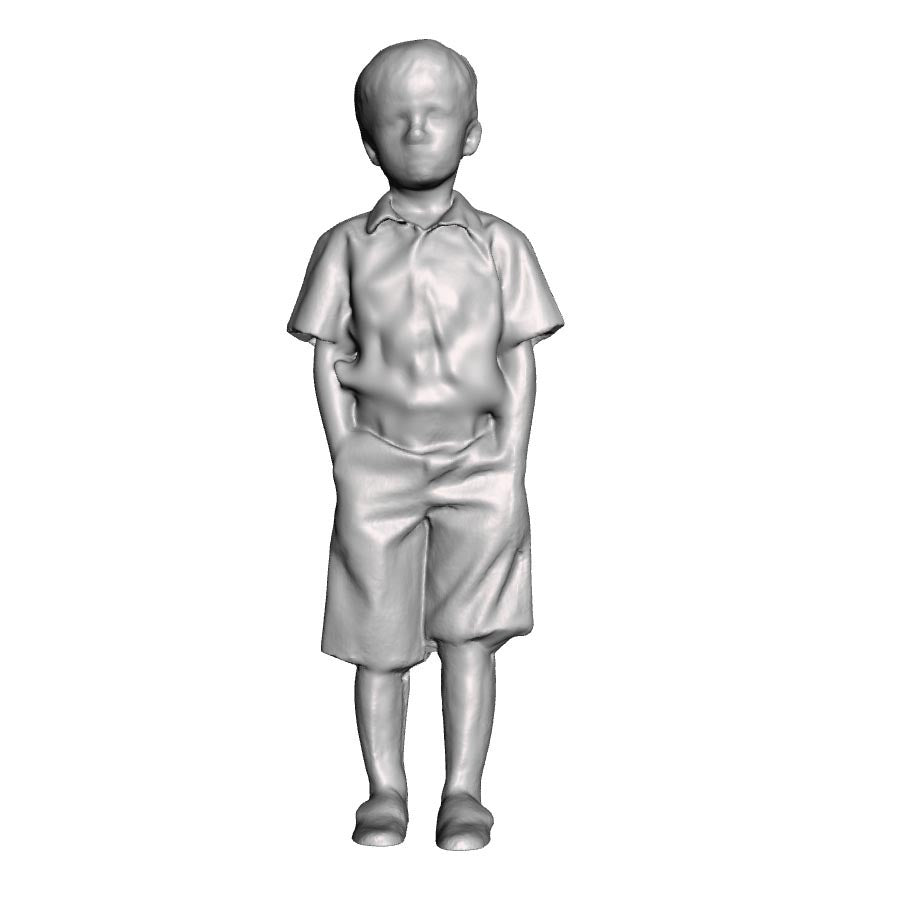 A boy with hands in pockets