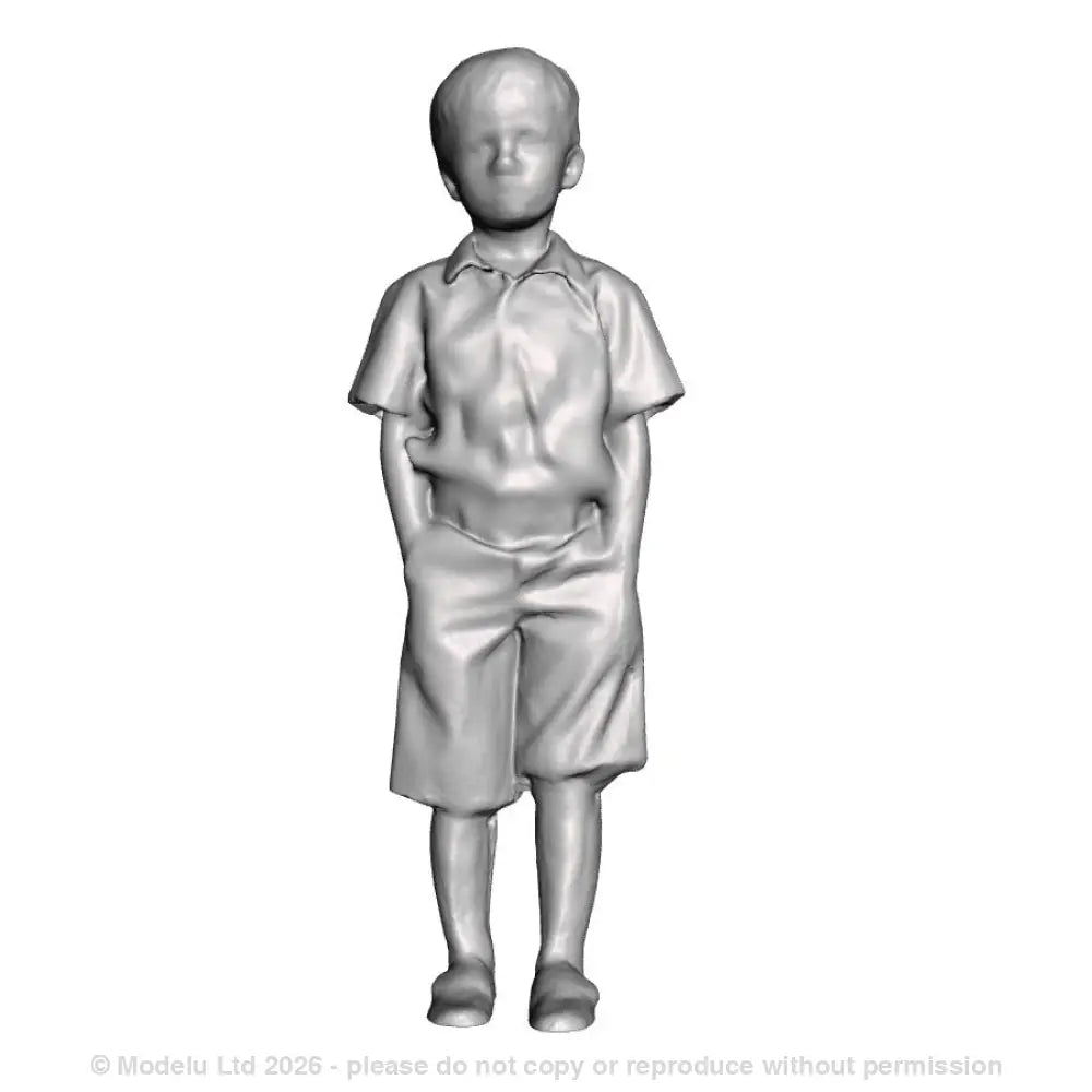 A boy with hands in pockets