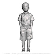 A boy with hands in pockets