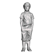 A boy with hands in pockets