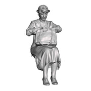 A seated woman looking in bag