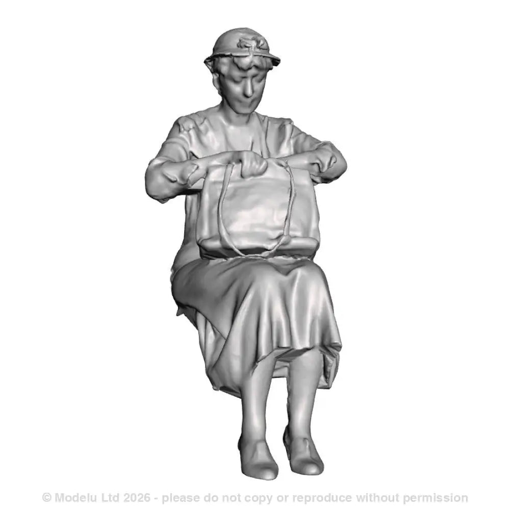 A seated woman looking in bag