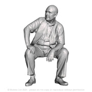 A seated man