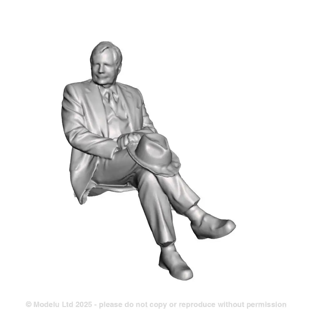 A seated man with crossed legs