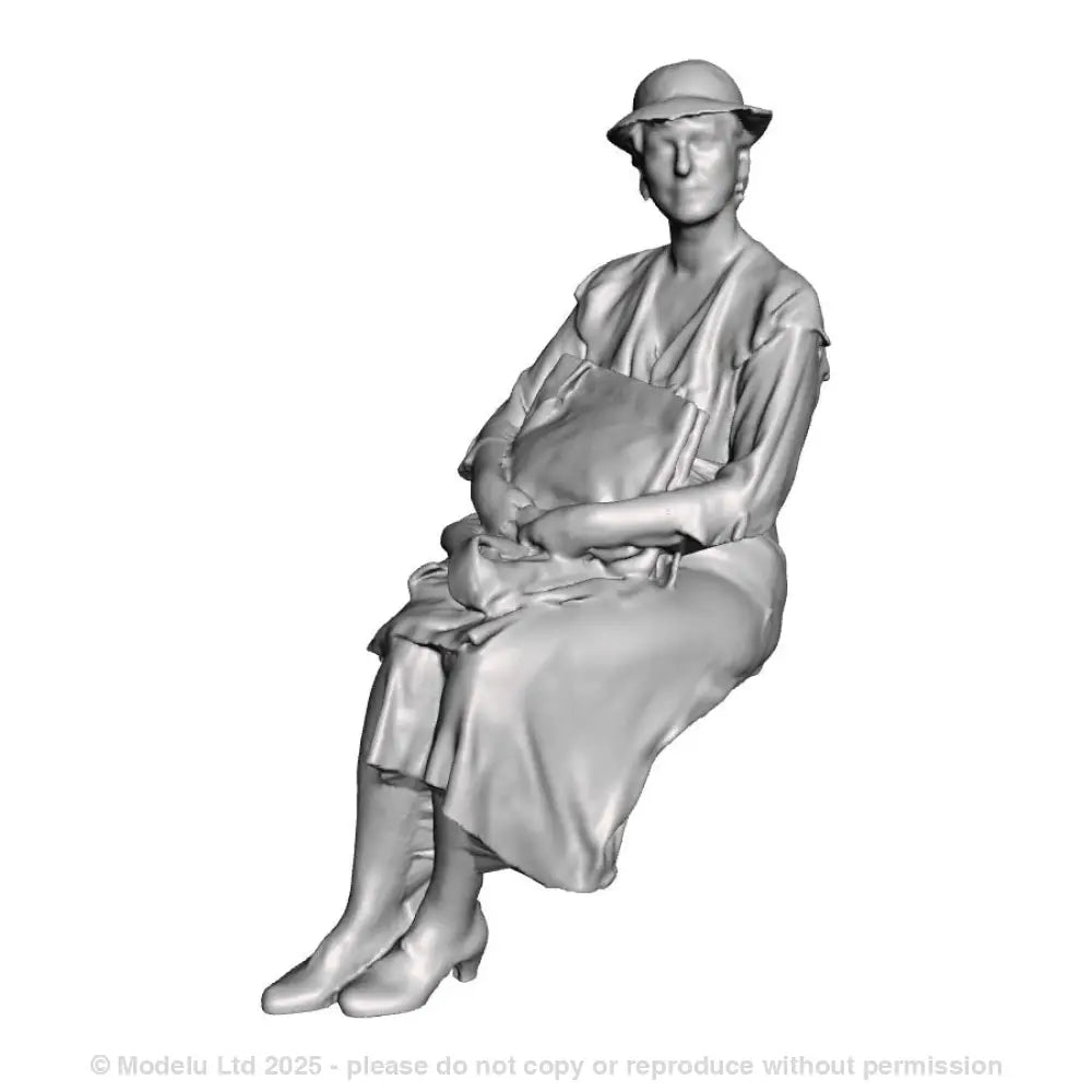 A seated woman with bag on lap