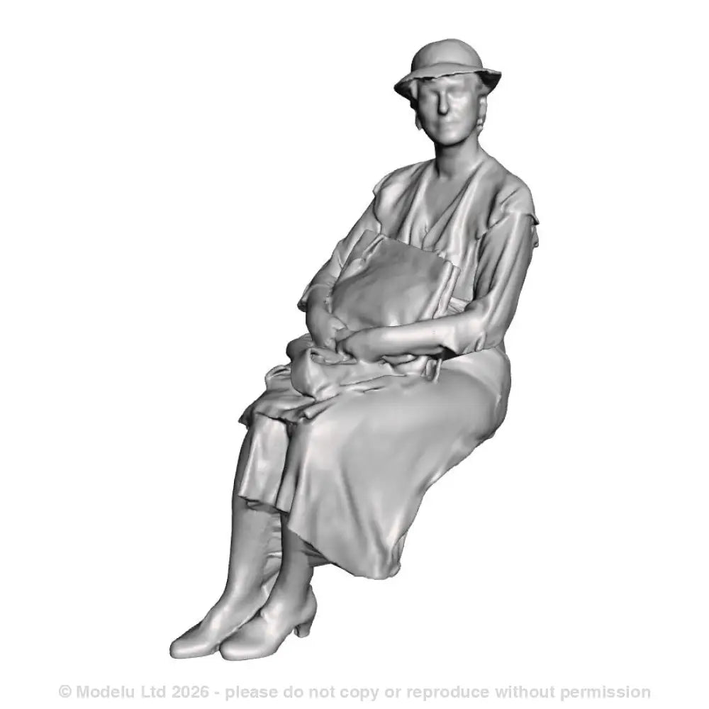 A seated woman with bag on lap