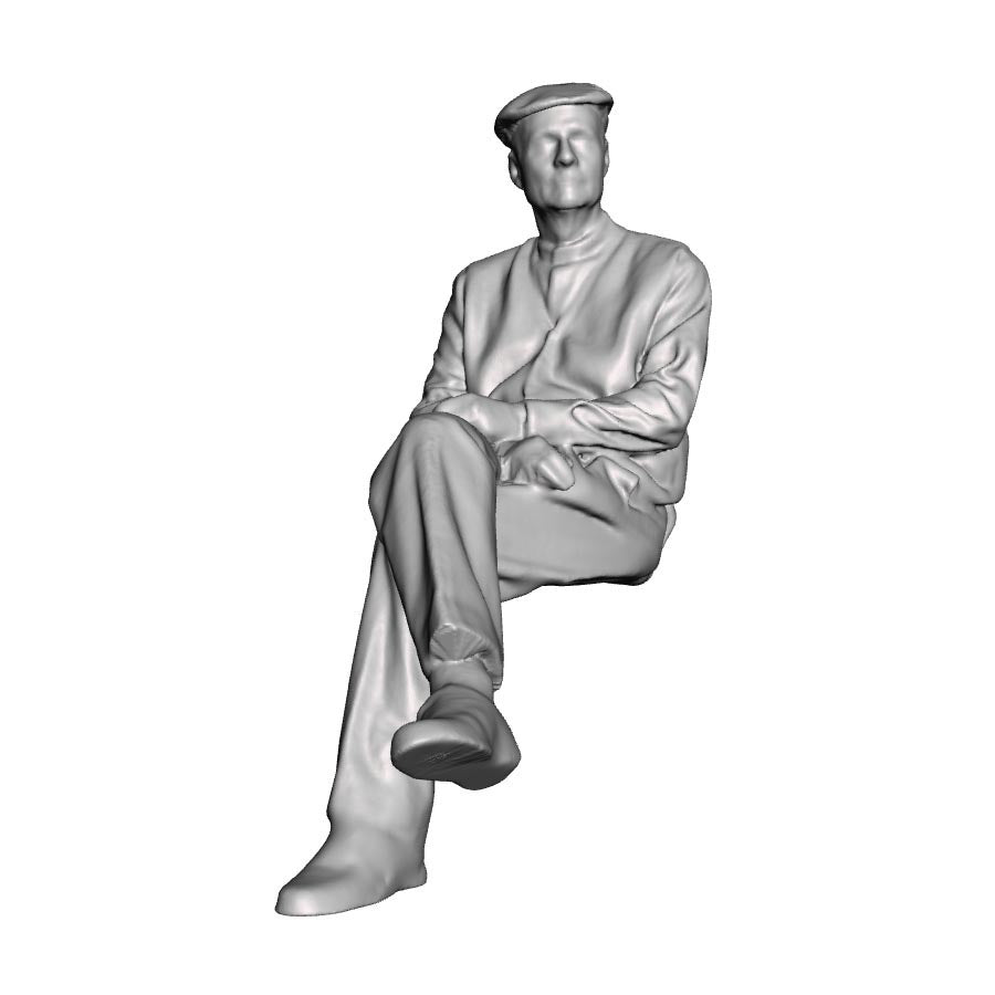 A seated man with crossed legs