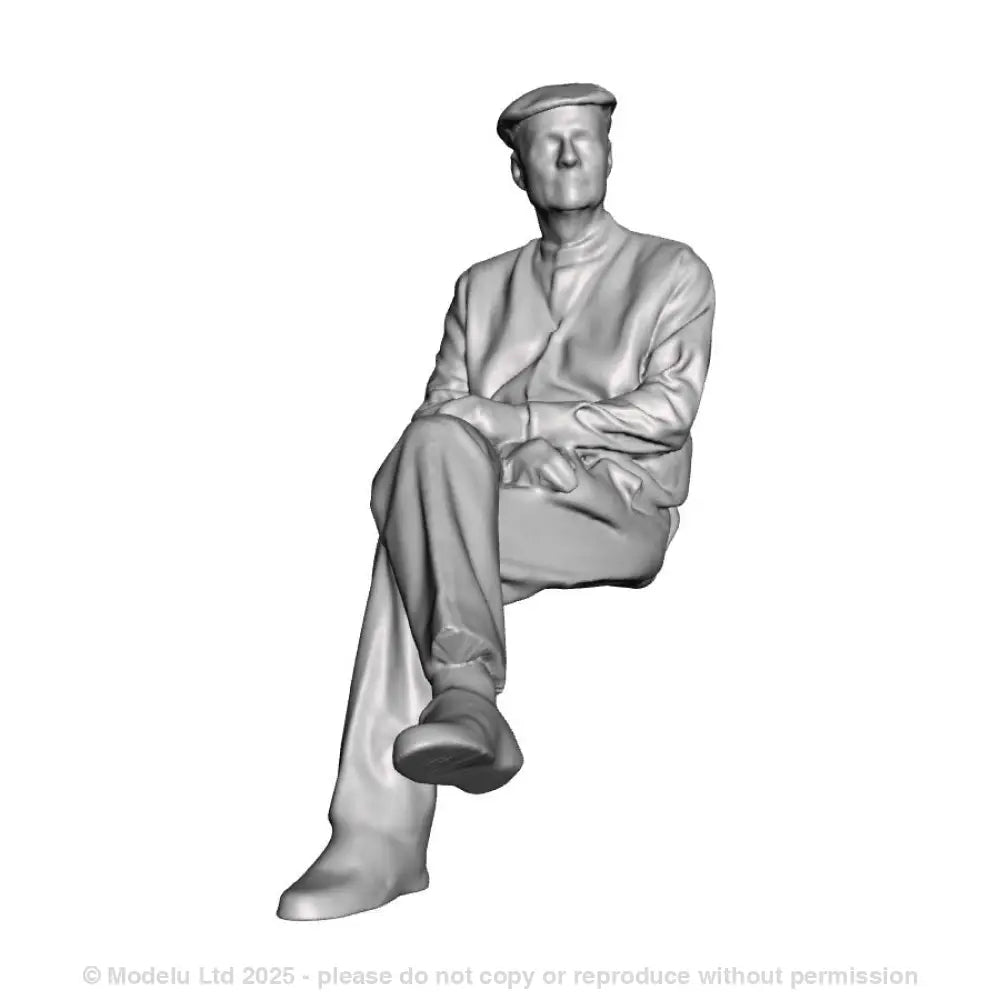 A seated man with crossed legs