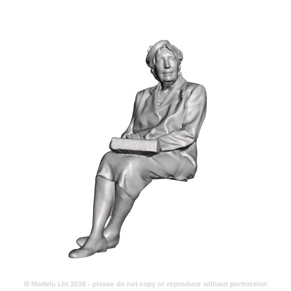 A seated woman with purse on lap