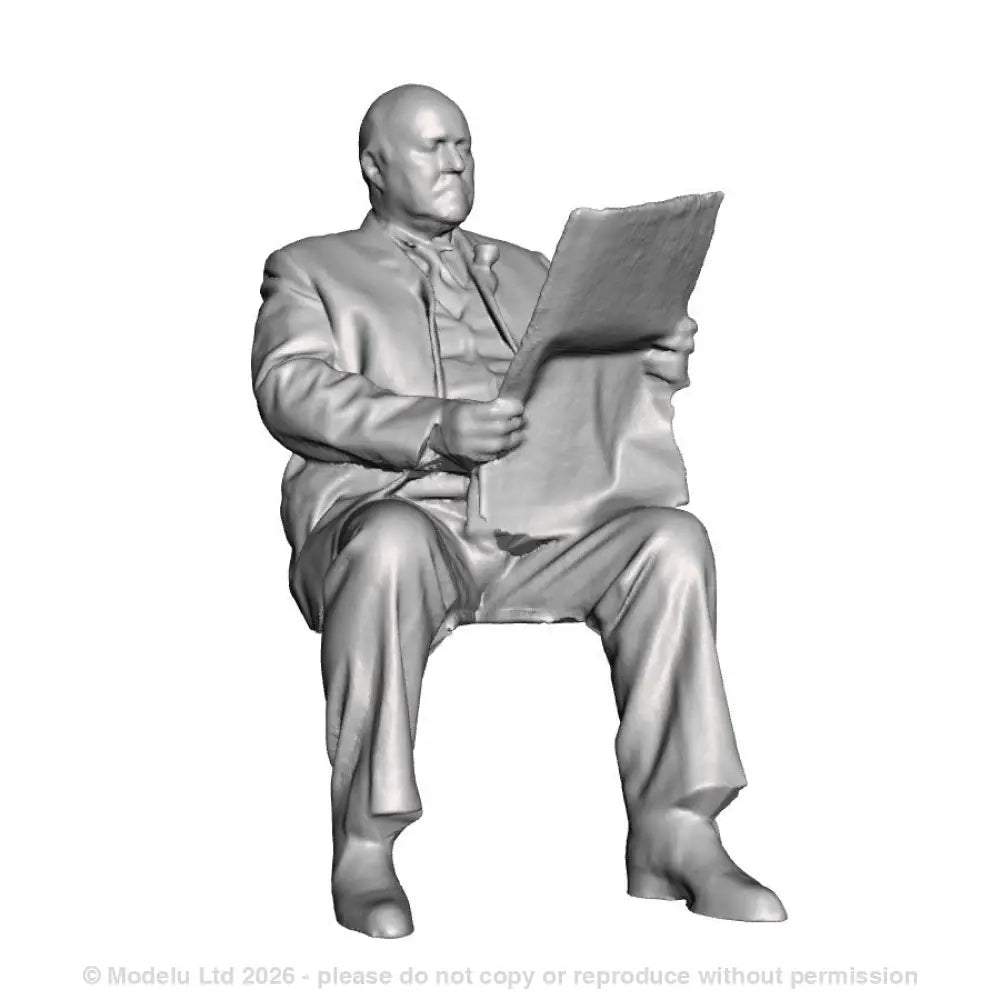 A seated man in suit reading newspaper