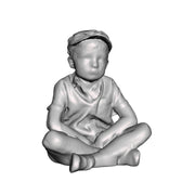 A boy sat cross legged