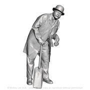 A fireman leaning wearing a bowler hat holding a firing shovel