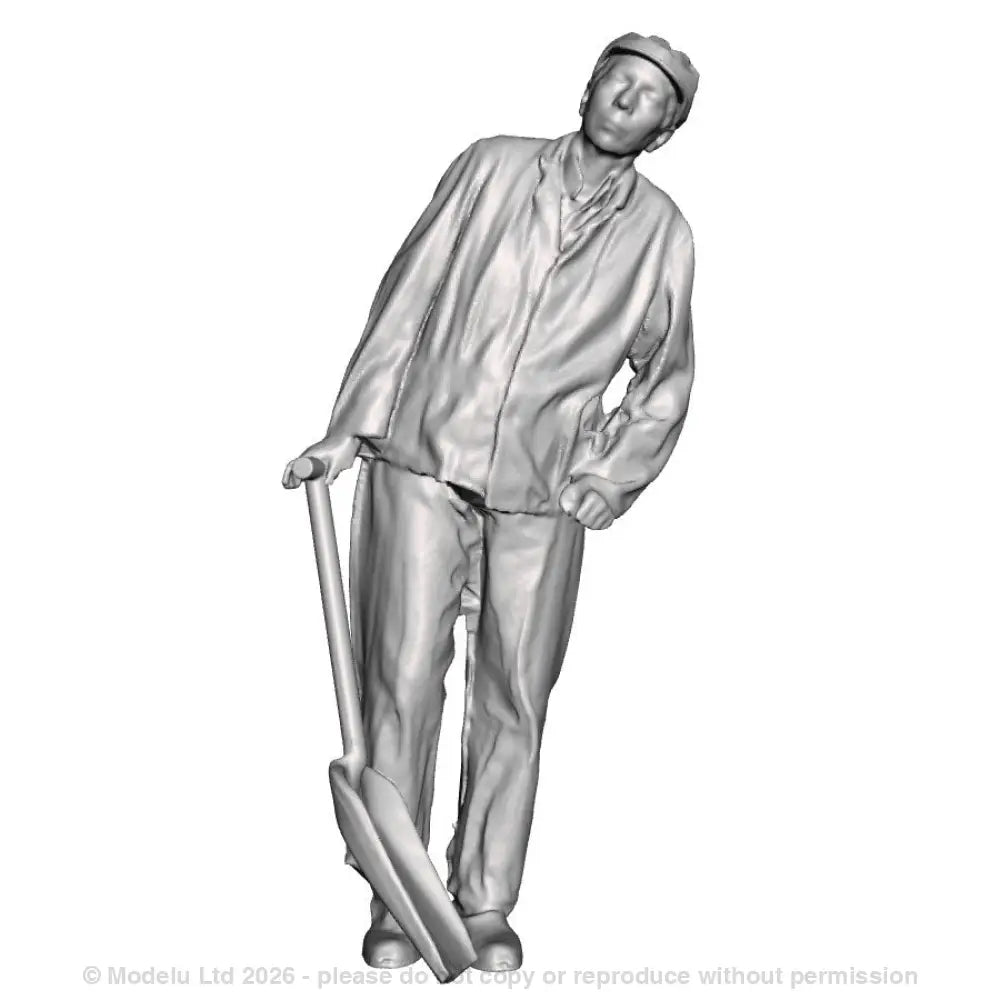 A GWR fireman leaning with firing shovel