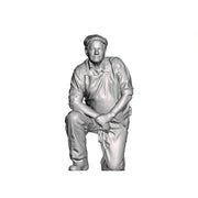 A cleaner kneeling