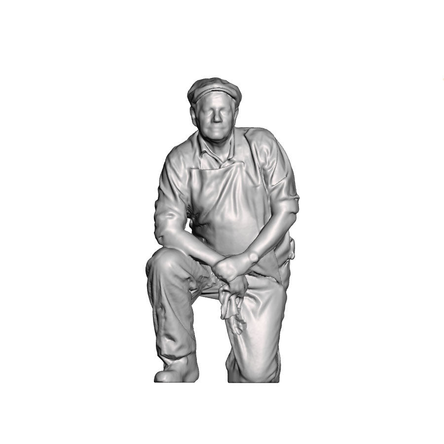 A cleaner kneeling