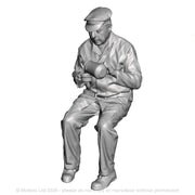 A seated lcoo crew pouring billy can