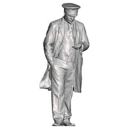 A guard or sttation master inspecting his pocket watch