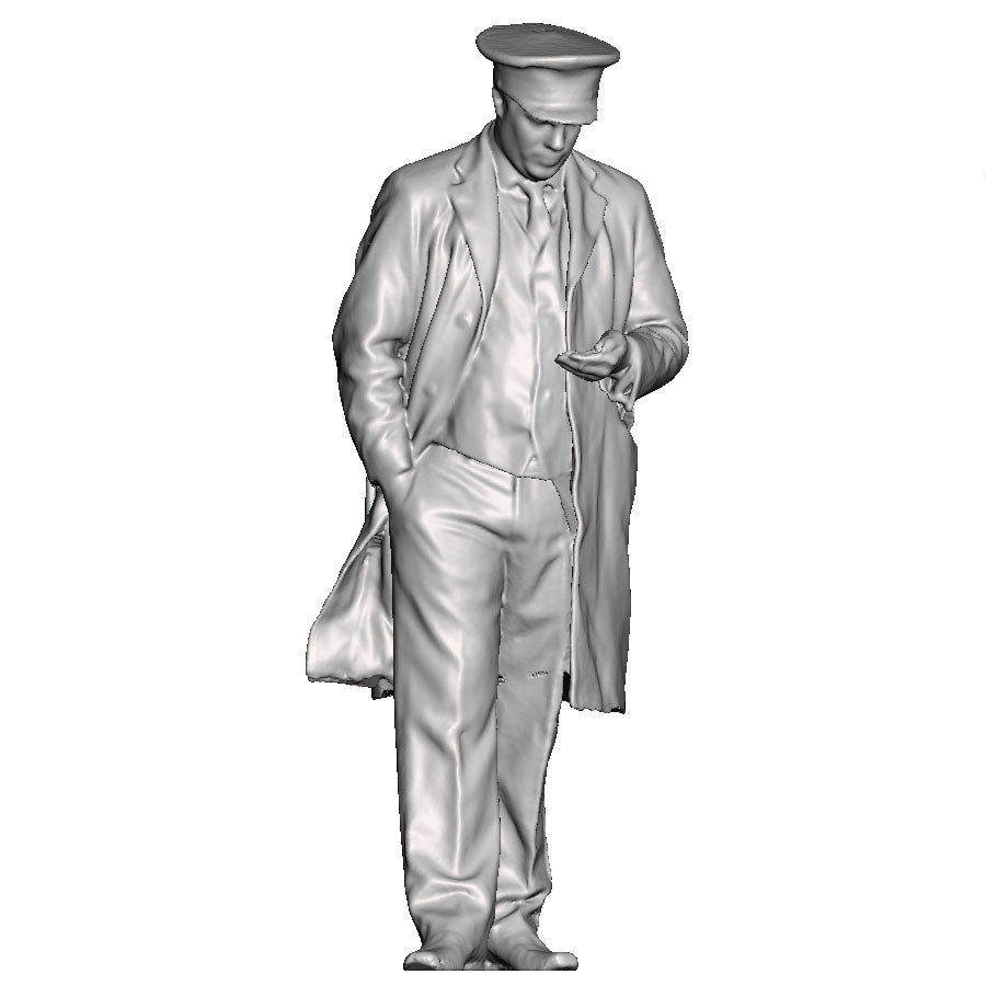 A guard or sttation master inspecting his pocket watch