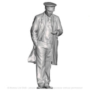 A guard or sttation master inspecting his pocket watch