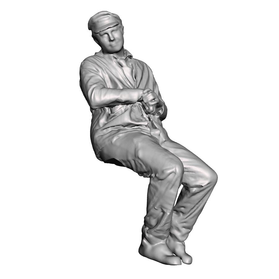 A loco crew man seated leaning