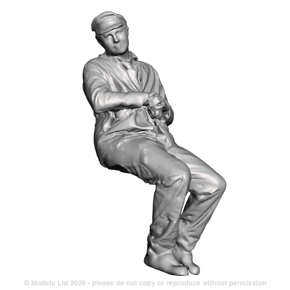 A loco crew man seated leaning