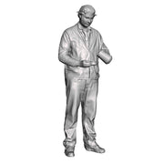 A loco crew man pouring a billy can