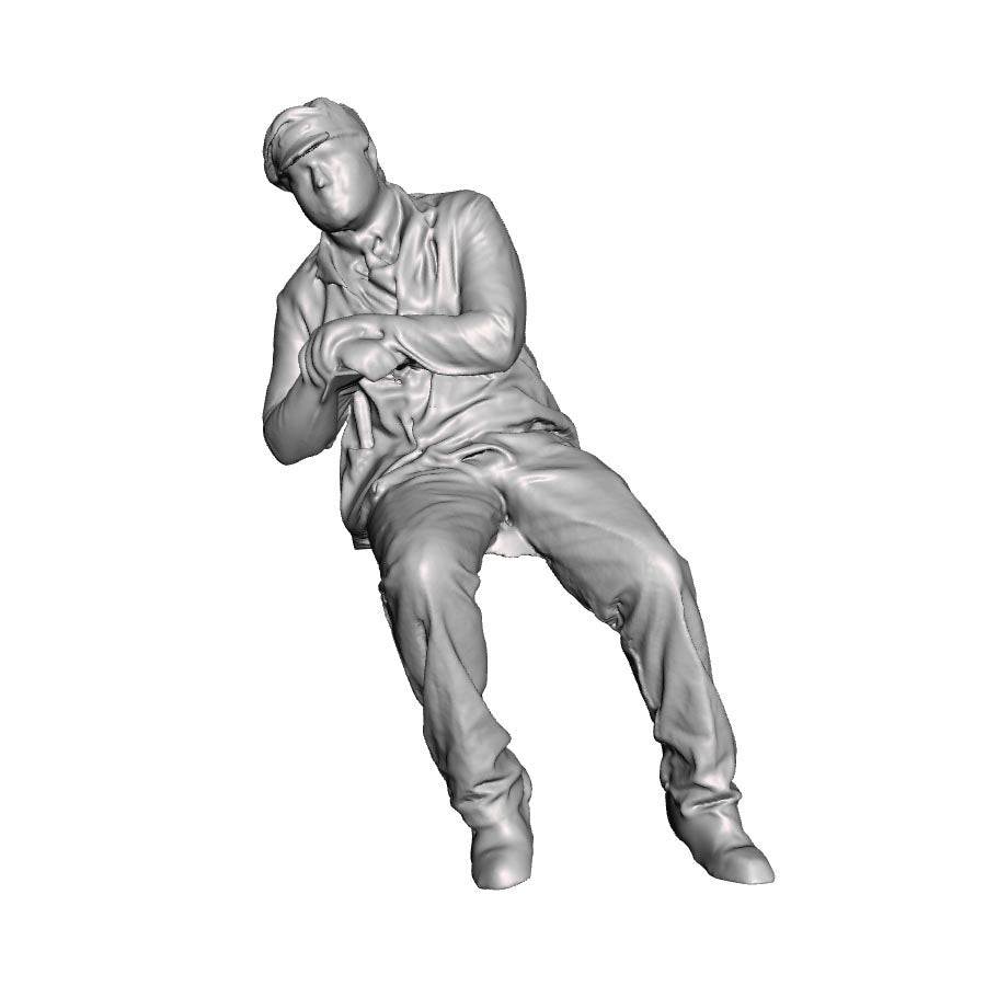 A loco crew man seated leaning