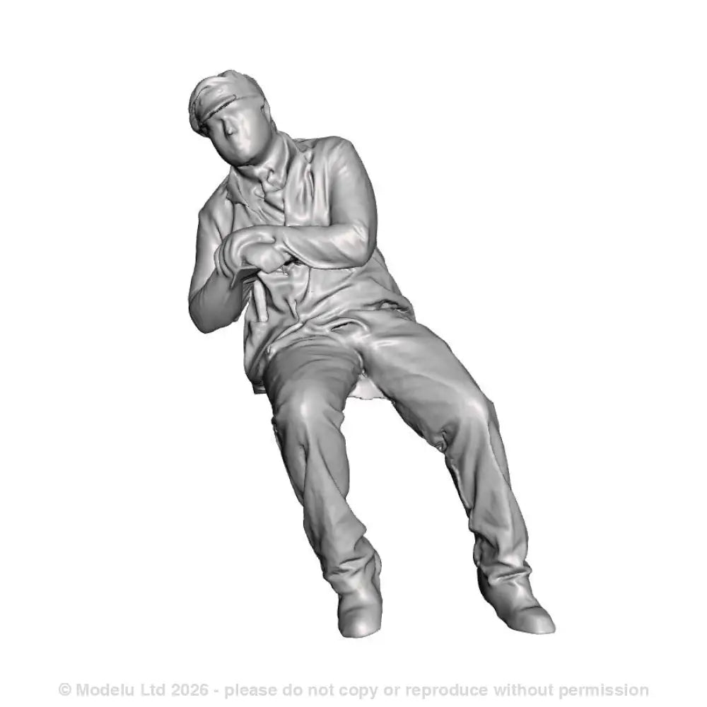 A loco crew man seated leaning