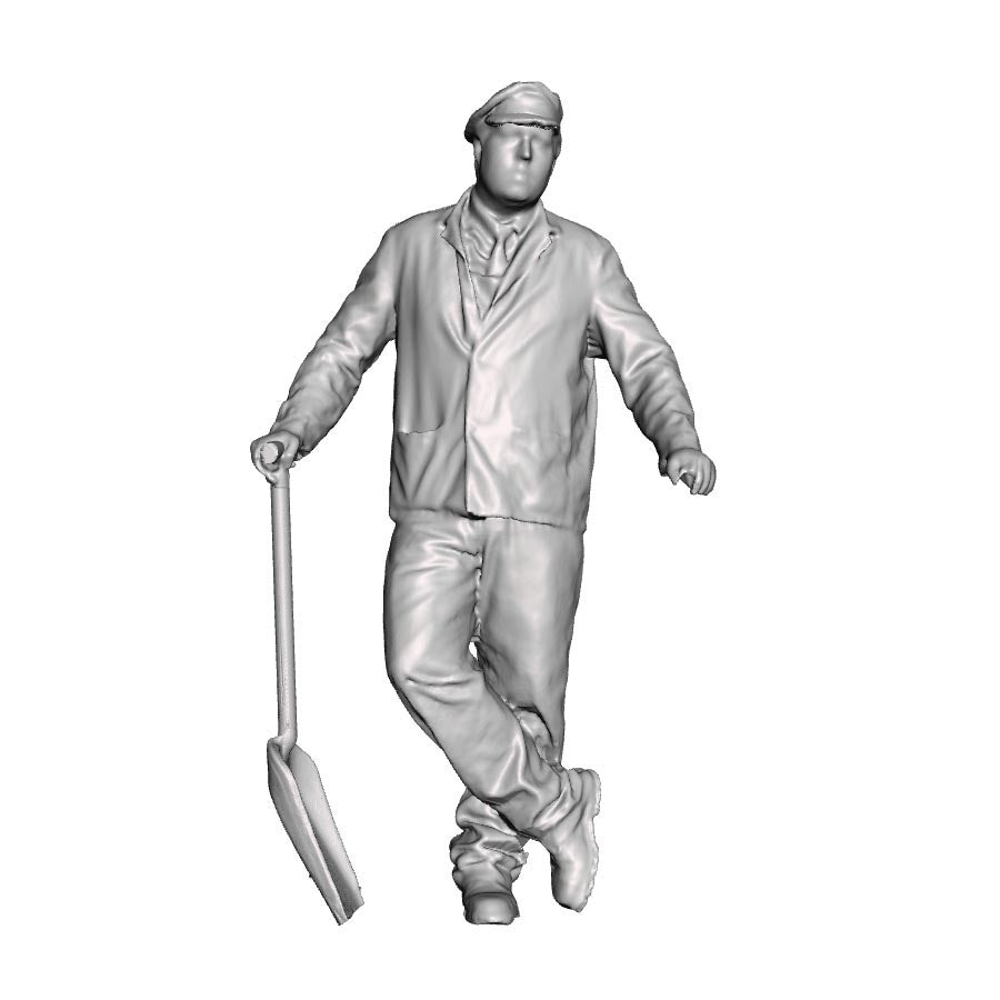 A fireman leaning holding a firing shovel