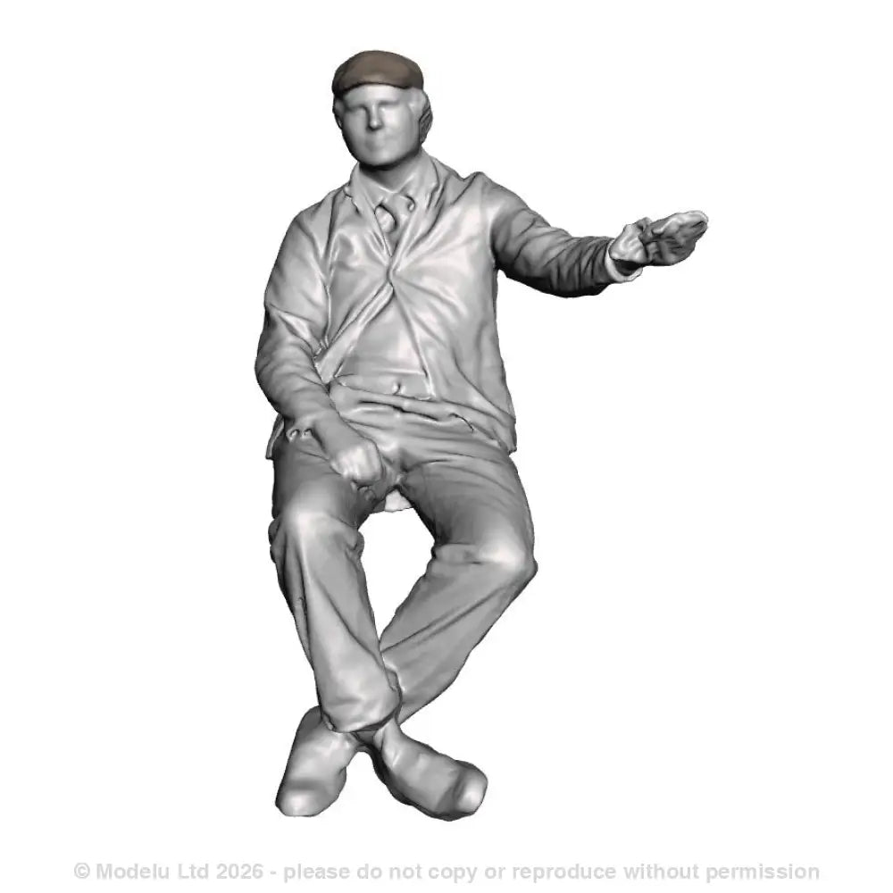 A loco driver seated operating a regulator