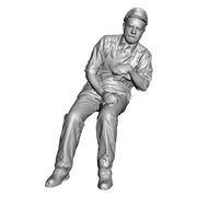 A loco crew man seated leaning