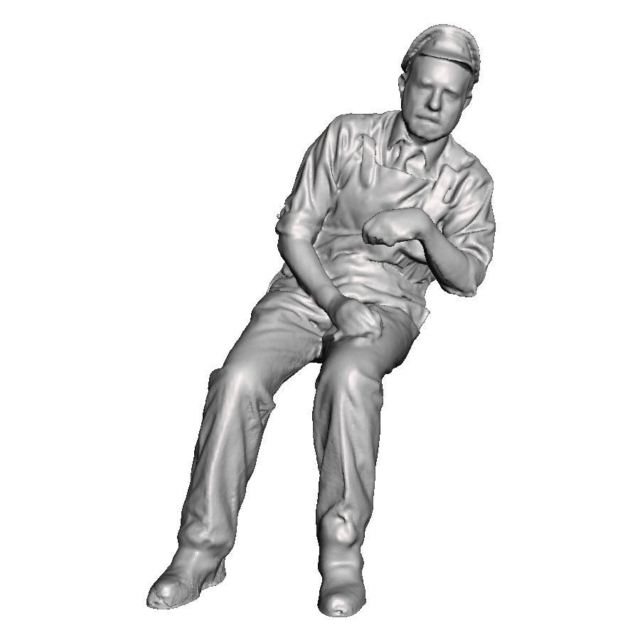 A loco crew man seated leaning