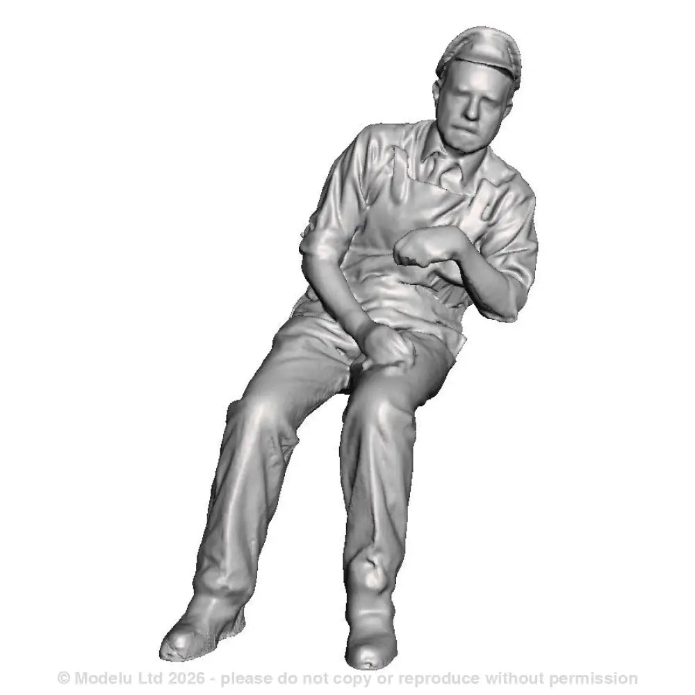 A loco crew man seated leaning