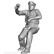 A loco crew man seated operating a regulator