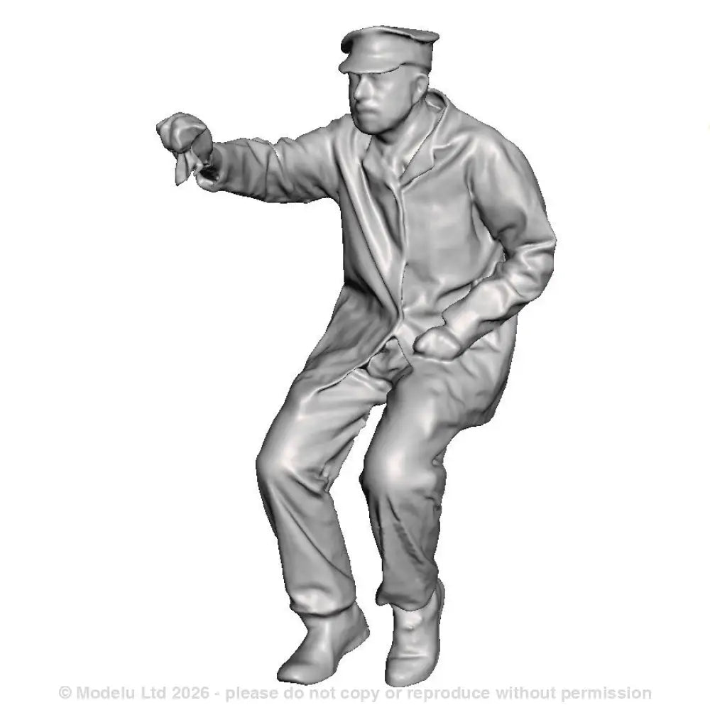 A loco crew man seated operating a regulator