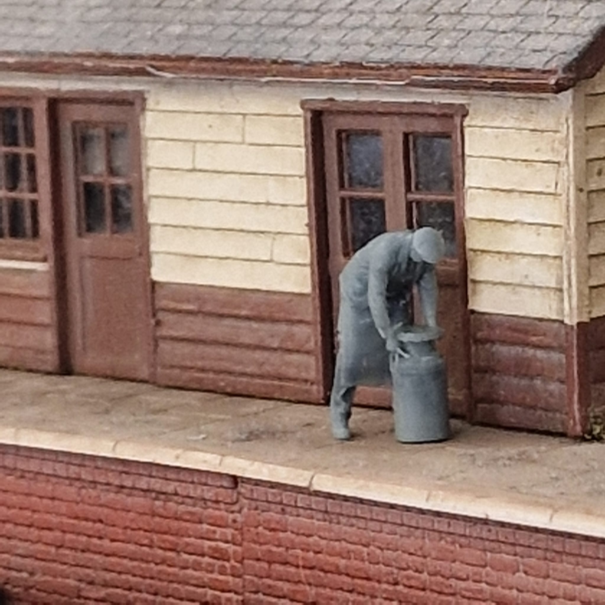 11110 Goods Worker moving milk churn