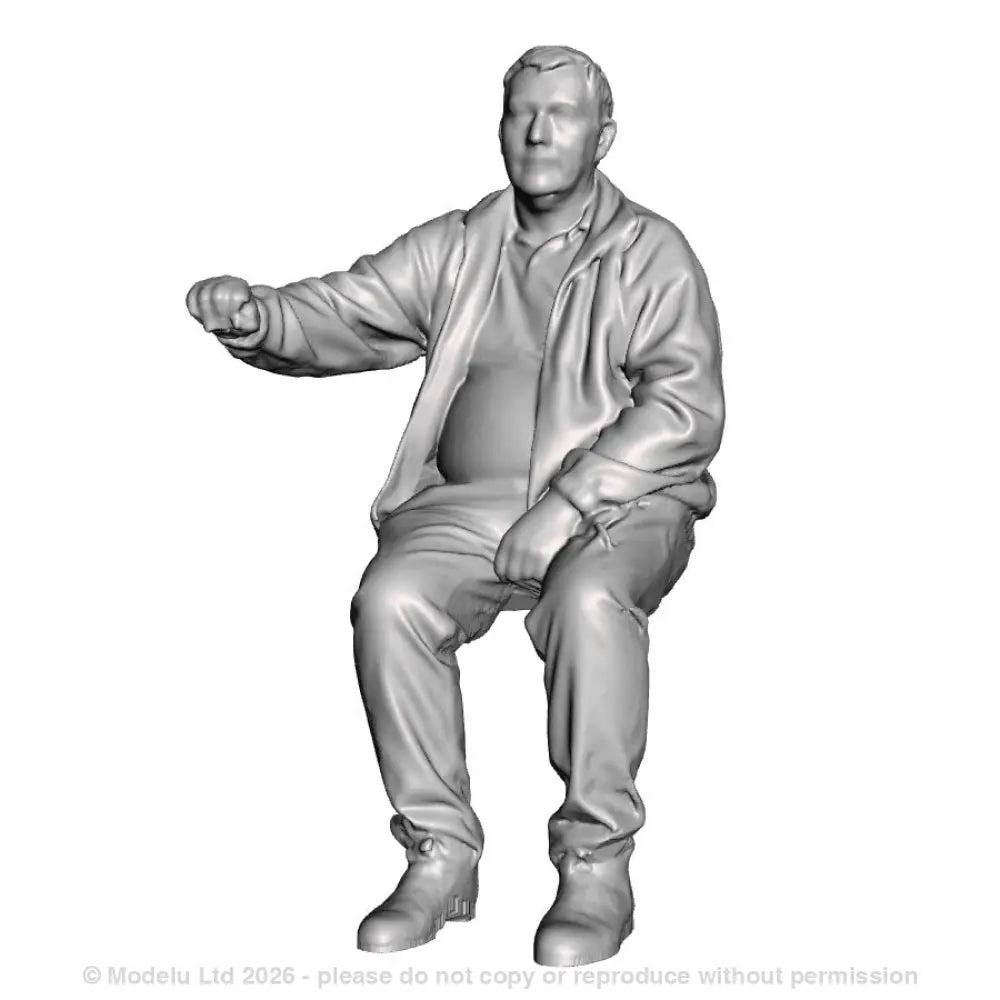 A loco driver seated operating a regulator