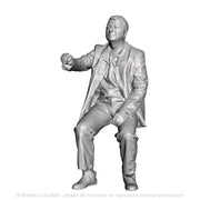 A loco driver seated operating a regulator