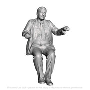 A loco driver seated operating a regulator