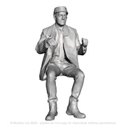 A loco driver seated operating a regulator