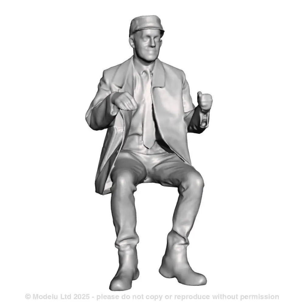 A loco driver seated operating a regulator