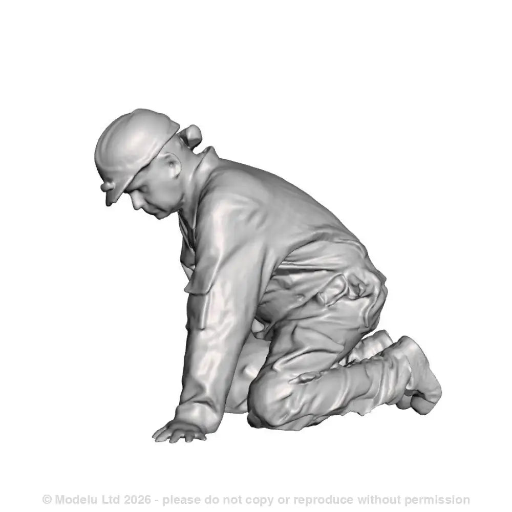An engineer kneeling