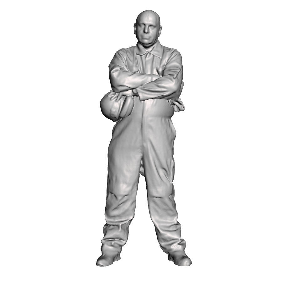 An engineer with arms folded
