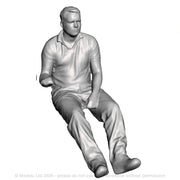 A loco driver seated operating a regulator