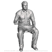 A loco driver seated operating a regulator