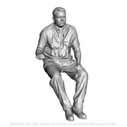 A loco driver seated operating a regulator